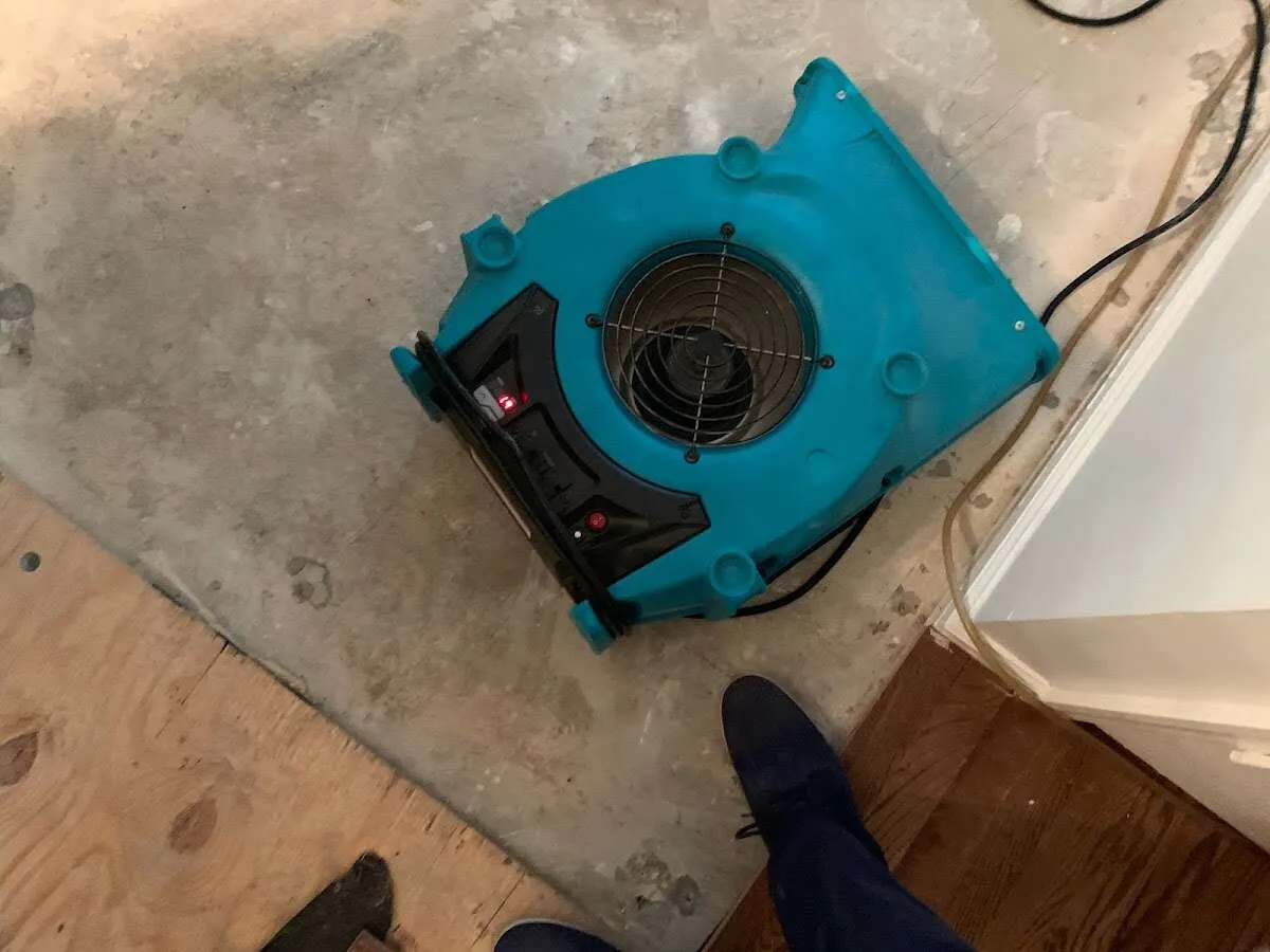 Air mover drying subfloor during Commercial Water Damage Restoration in Mesquite